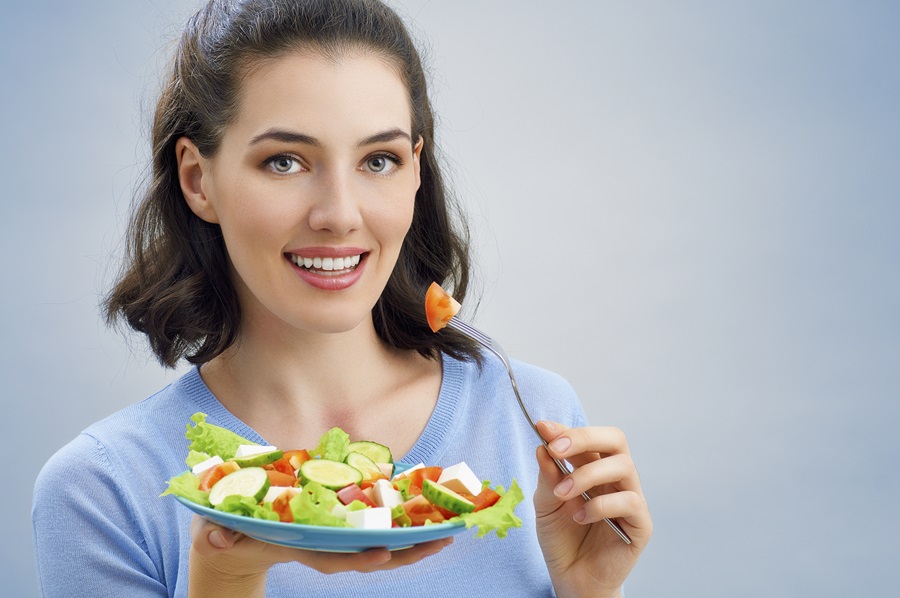 A beautiful girl eating healthy food